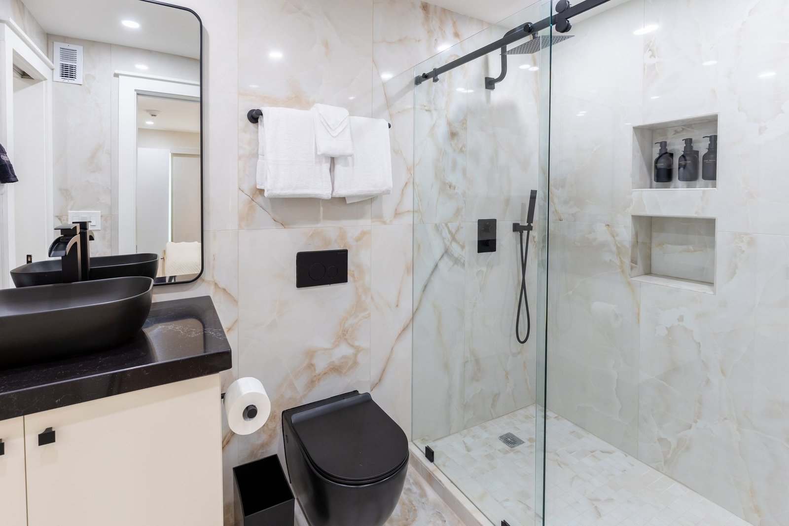Luxury marble bathroom with black vessel sink